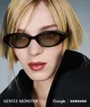 The image shows a woman wearing black Google intelligent eyewear frames by Gentle Monster.